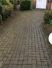 Illustrative driveway before pressure cleaning